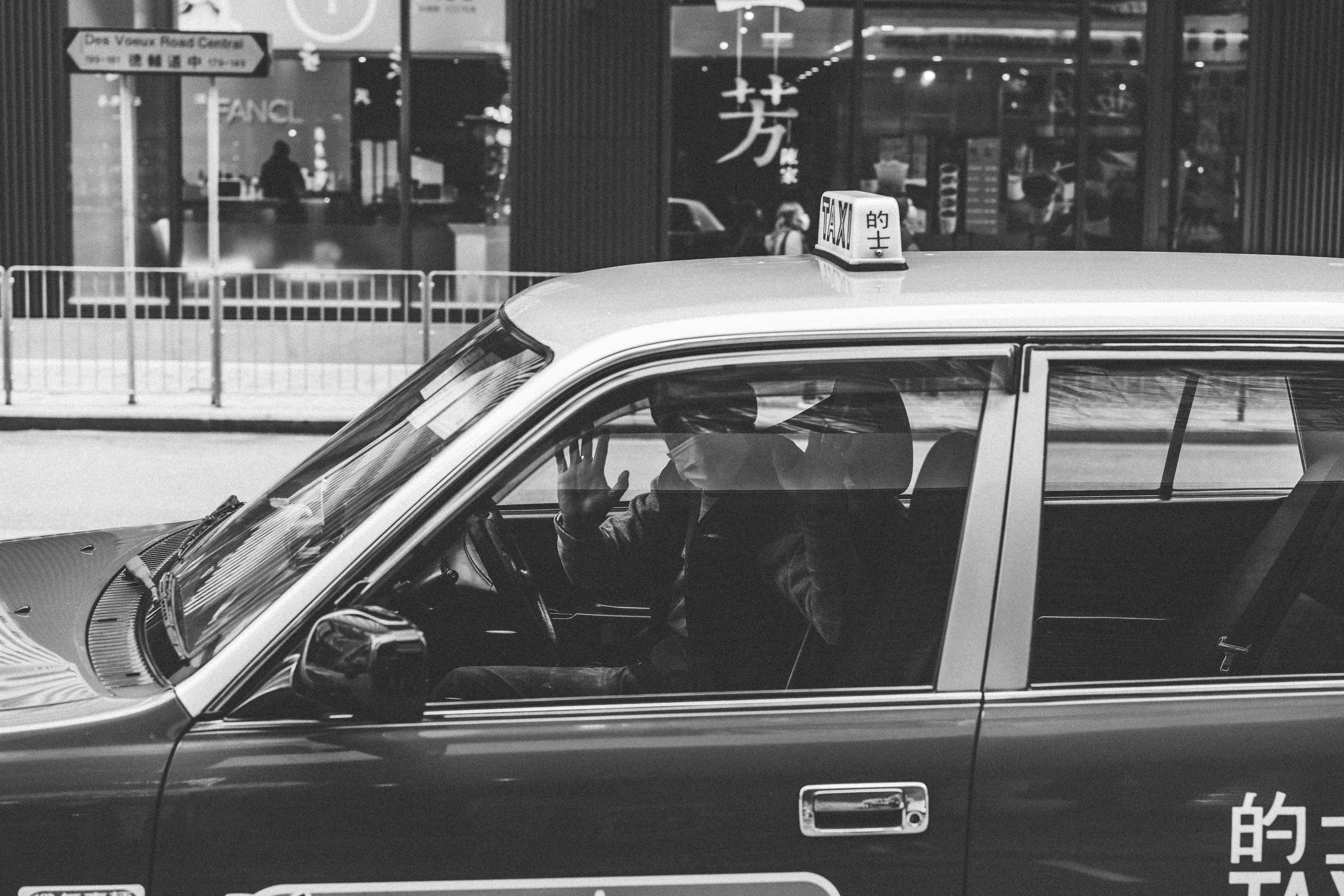 grayscale photo of car on road